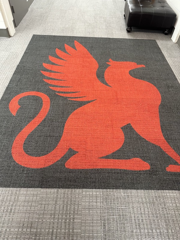 Custom carpet tile with a red griffin, the Spartanburg Day School's mascot.
